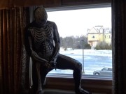 Preview 1 of Dawn of the dead morphsuit in window cums into black rubber cock extender