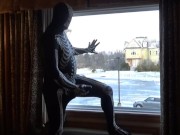 Preview 2 of Dawn of the dead morphsuit in window cums into black rubber cock extender