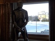 Preview 4 of Dawn of the dead morphsuit in window cums into black rubber cock extender