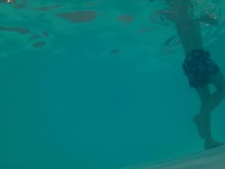 Twink loses trunks in hotel pool and swims naked