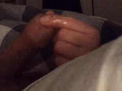 Close up POV handjob from wife in bed while she plays on her smartphone