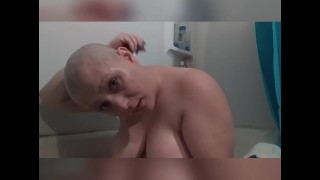 Shaving head in the tub naked