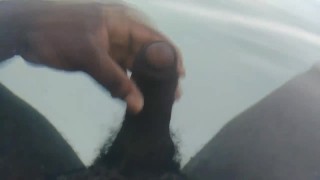 Thick black dick jerks off under water