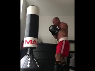 Working the Bag in Red Boxing Trunks