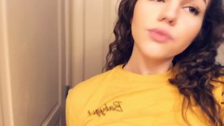 Cute curly haired teen plays with her tits 
