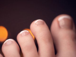solo female, french tip feet, close up, painting toenails