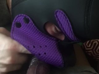 Purple puppy sucking some black balls