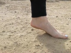 Super slow motion feet walking on dusty ground -- DIRTY FEET
