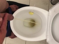 Pissing in toilet