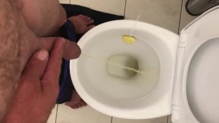 Pissing in toilet