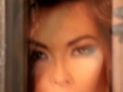 Tera Patrick caged in sexy erotic video stripping to be naked