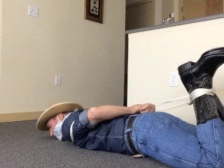 Hogtied Gagged Cowboy in Tight Wranglers