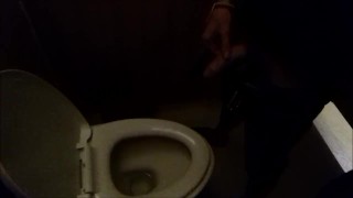 A Man Defecates In A Public Restroom