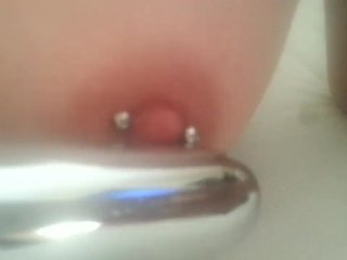 Play with my pierced nipples with silver vibrator