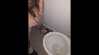 Boy pissing toilet