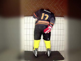 Rubber hockey pup pawing off