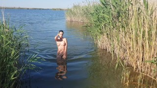 The girl goes completely naked out of the river
