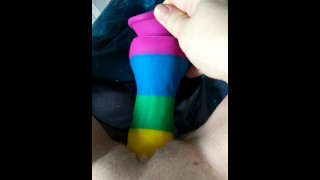 Cumming on a rainbow dildo in bed