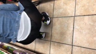 Black transparent tight bending over in store