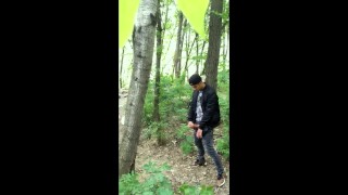 Bad boy jerks while smoking cigarette in a forest - almost caught - so his balls stay full