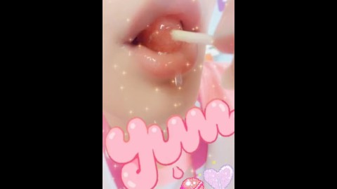 Drooling girl eating yummy lollipop