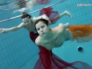 Two hotties submerged underwater