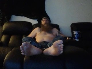 Bob hanging out barefoot in jeans