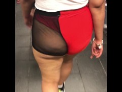 Wife in mesh see through shorts walking around train station