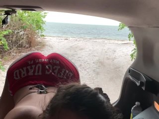 Ashley sucks cock on a public beach in red chucks!