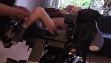 Cripple in wheelchair gets his legs spread and his dick teased