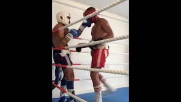 Boxers in full gear kiss frot and punch