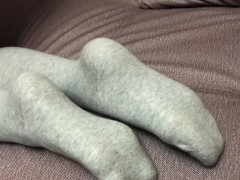 Sexy girl show feet in pantyhose and gray knee socks stockings
