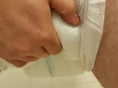 Playing with my diaper filled to the max