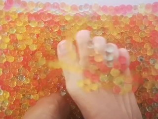 Feet Playing in Orbeez