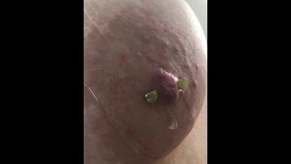 Dripping oil on my pierced tits