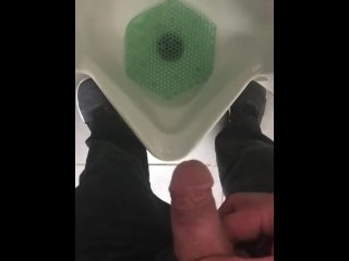Pissing in a urinal in public at work
