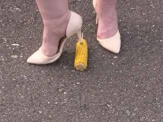 Crush-fetish. Thick legs in heels crushed the corn mercilessly.