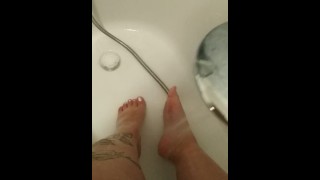 Fat legs feet washing after long day at work