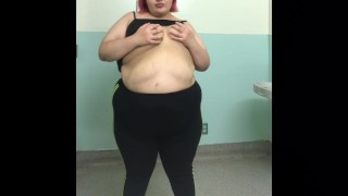 SSBBW Latina Teen shaking ass and big belly in a public bathroom