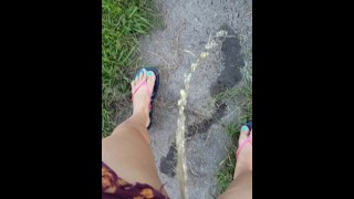 Girl Pees While Walking Down Public Sidewalk 