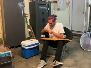Putting riser pads on my roommates skateboard in my garage
