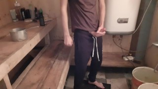 Slender guy fingering in sweatpants