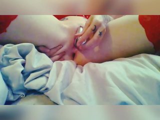 Tattooed Babe wearing red stockings takes toy in both holes.