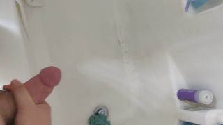 Young cock shooting cum into the shower