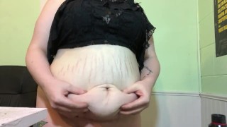 Sexy milf plays with belly