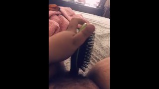 Horny slut spreads her legs to fuck her hairbrush