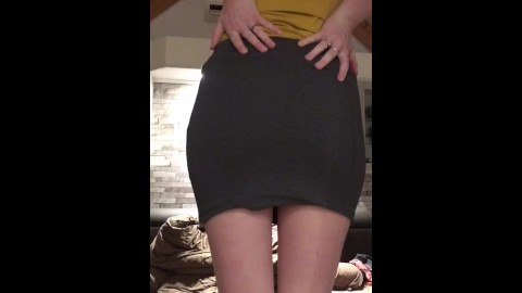 Milf shows her big booty in a tight skirt.