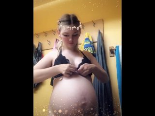 Watch a pregnant MILF strip