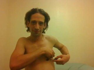 Topless Transgirl Trying to Hold a Pen w/Her Tiny Boobs