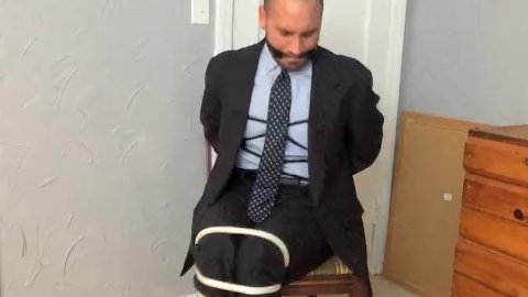 Chairtied in a Suit